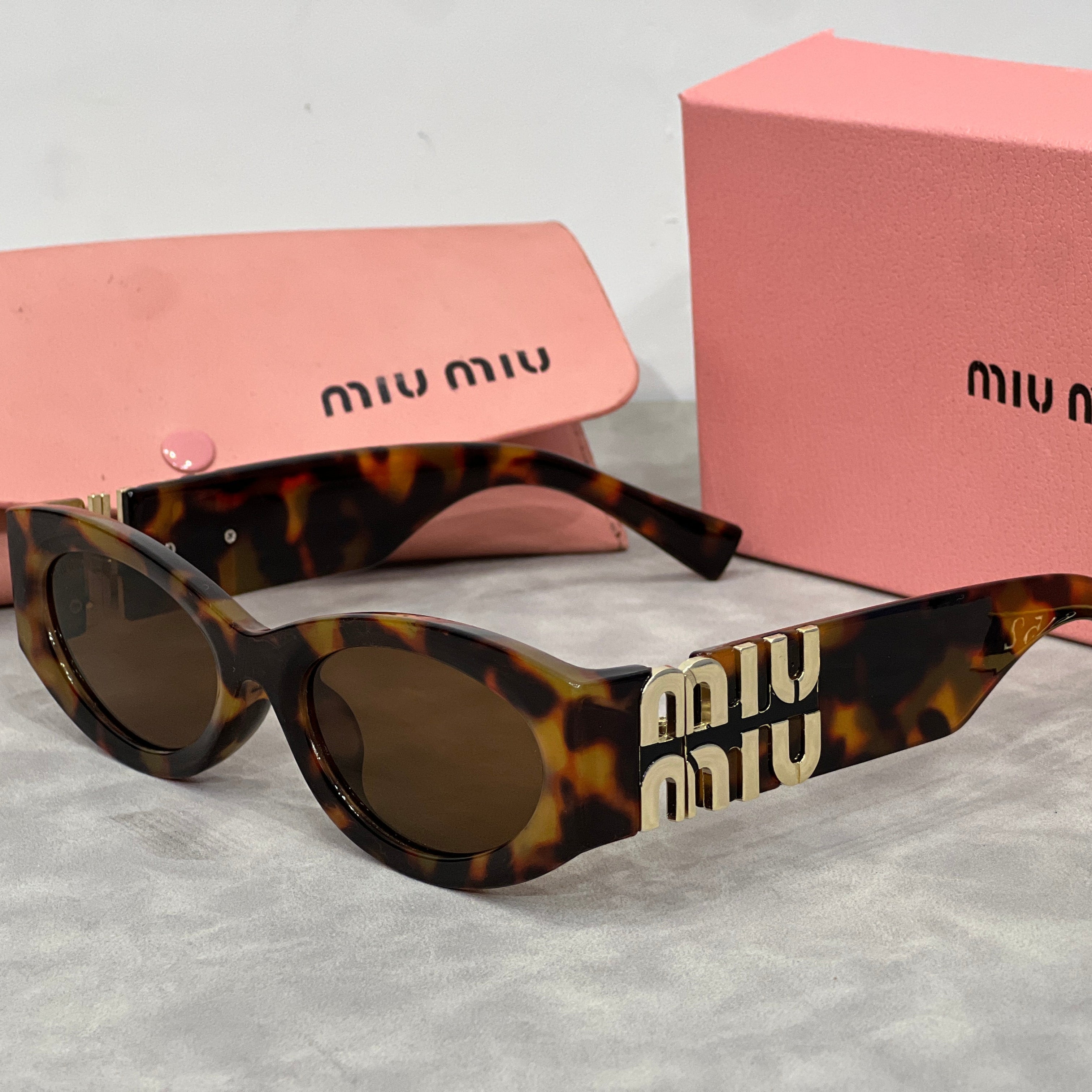Miu Miu Cat Eye Sunglasses with Logo
