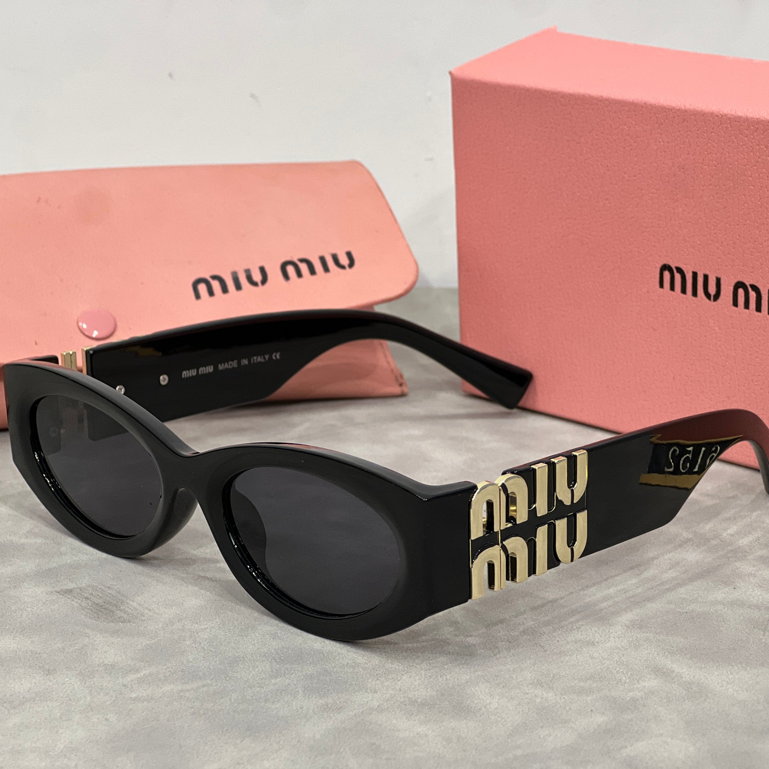 Miu Miu Cat Eye Sunglasses with Logo